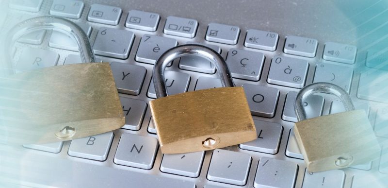 padlocks sitting on a keyboard